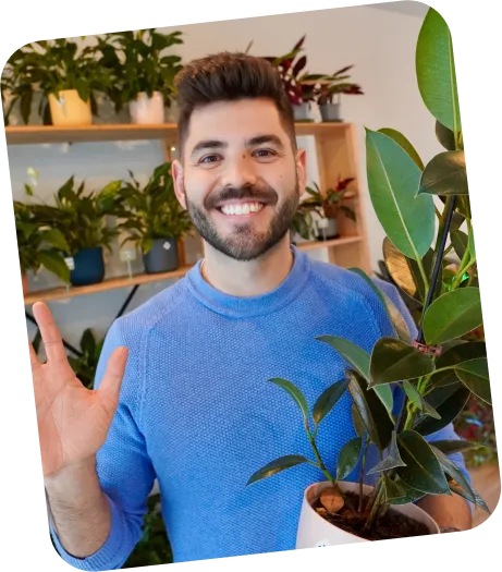 Steven waving in a plant shop